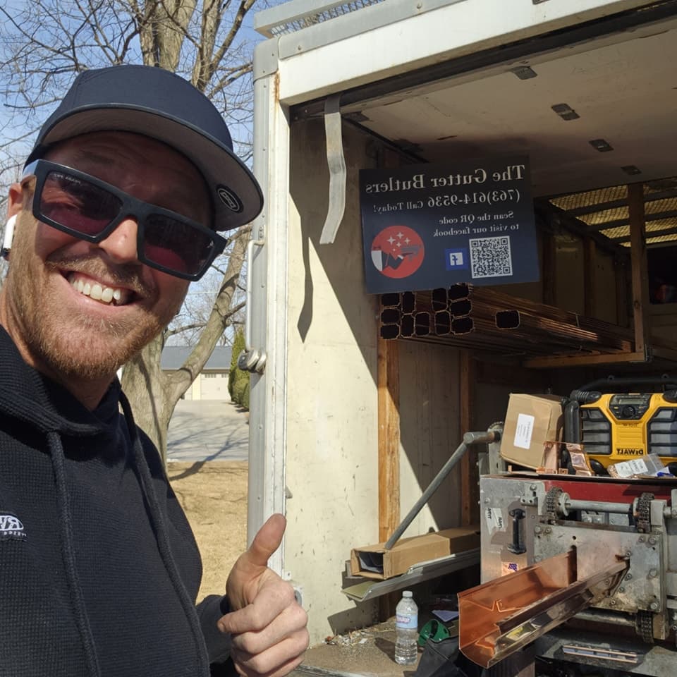 Derek and the Gutter Butlers fabrication trailer with copper-colored seamless gutters